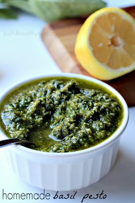 Cauliflower Alfredo Sauce Basil Pesto in a Small White Dish Beside Half a Lemon