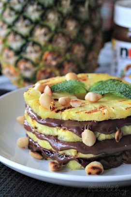 The Most Popular Recipes of Joyful Healthy Eats 2014 | m.albarakaa.com | #mostpinned #healthy #recipes #food Layered pineapple slices and nutella on a plate with macadamia nuts
