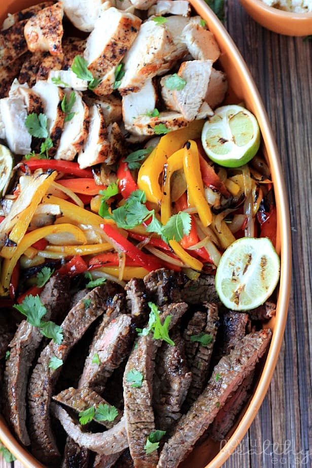 Grilled Fajita Skirt Steak #Steak #MexicanFood #cincodemayo #fajitas #marinade #paleo #glutenfree Sliced Grilled Fajita Skirt Steak, Sliced Grilled Chicken , Peppers and Onions on a platter