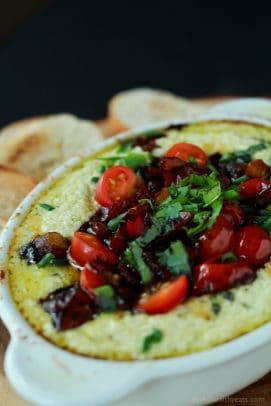 The Most Popular Recipes of Joyful Healthy Eats 2014 | m.albarakaa.com | #mostpinned #healthy #recipes #food Baked goat cheese dip in a ramekin topped with tomatoes and herbs