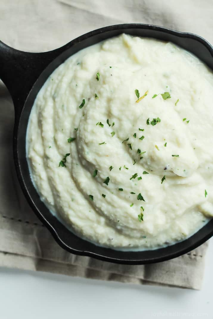 Cauliflower Alfredo Sauce A Close-up View of Cauliflower Alfredo Sauce in a Small Black Skillet