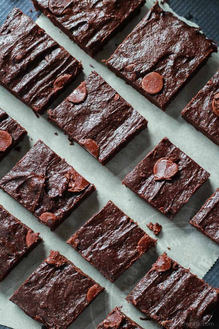 The Best Fudgy Avocado Brownies you will ever taste, packed with coconut sugar, chocolate chips, and coffee! The perfect guilt free dessert recipe for the summer! | joyfulhealthyeats.com #recipes Top view of Fudgy Avocado Brownies cut into squares