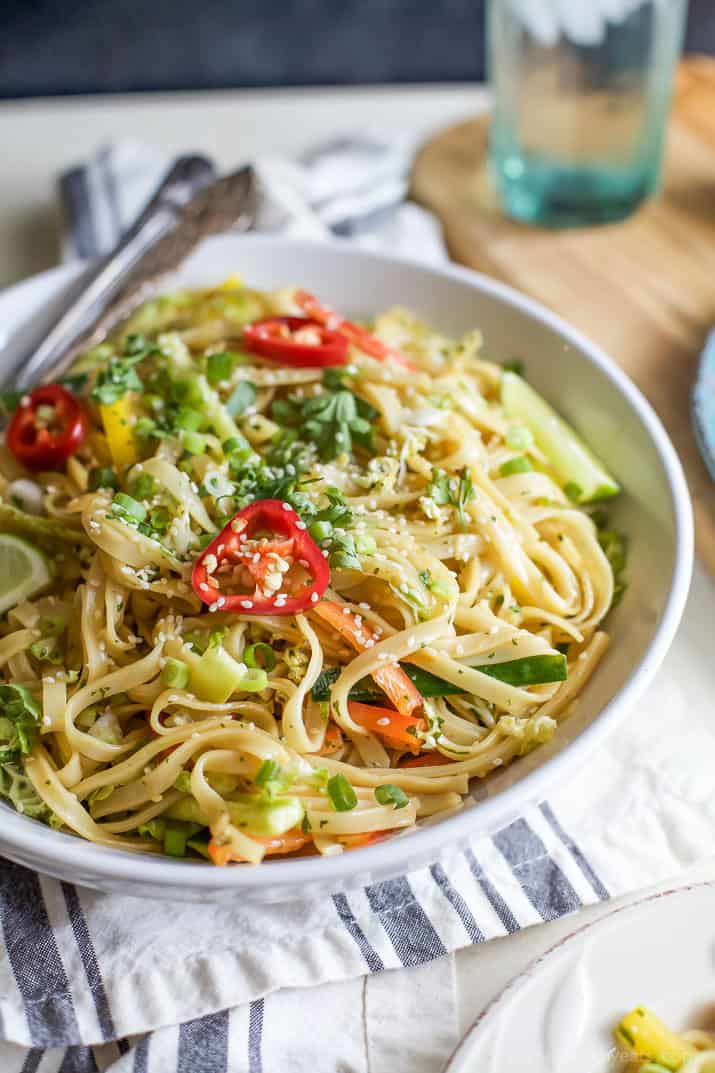Asian Noodle Salad with a Spicy Sesame Dressing and sliced red pepper rings in a bowl