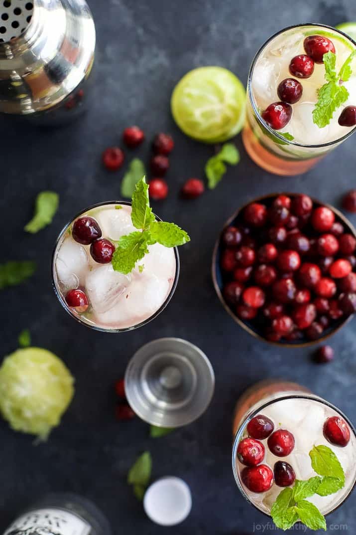 Top view of glasses of Holiday Cranberry Mojito and配料