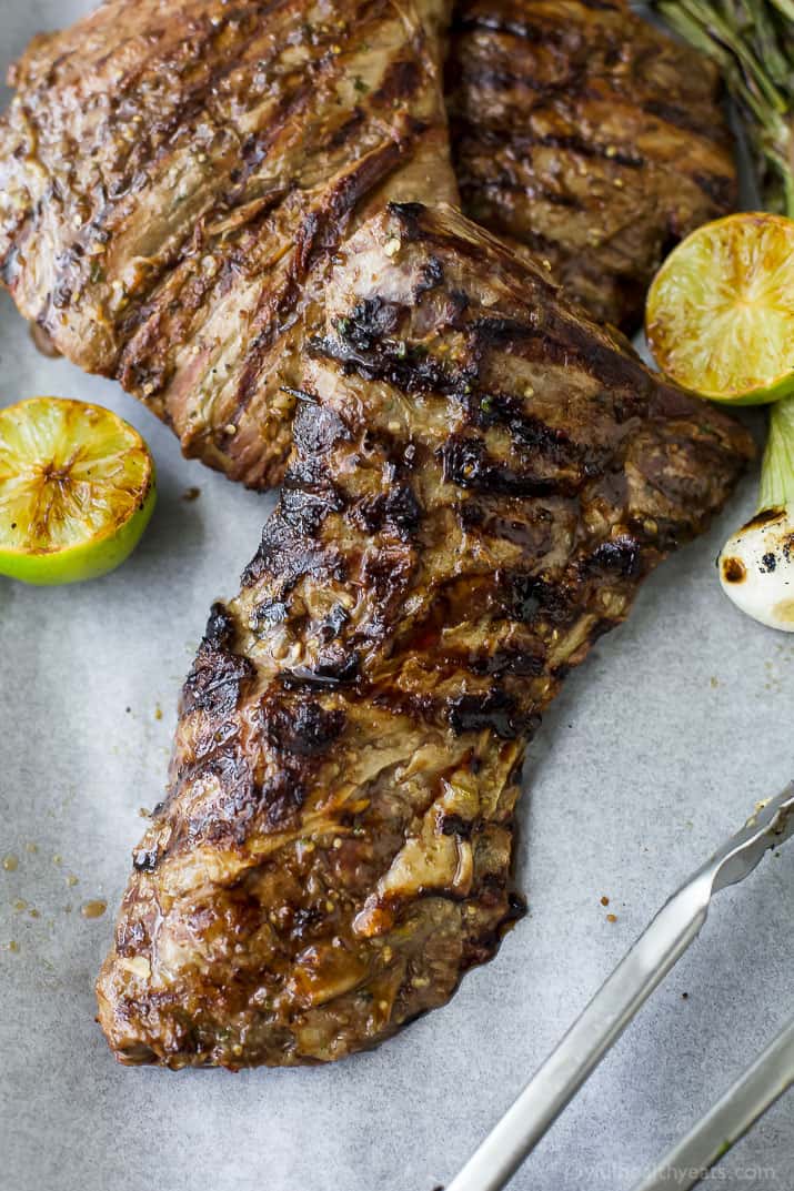 Tender grilled Carne Asada that's marinaded in a homemade Salsa Verde then charred to perfection for one authentic mexican dish! This flavorful low carb Carne Asada will be a hit at your house! Great for a weeknight dinner or dinner parties! #paleo #glutenfree
