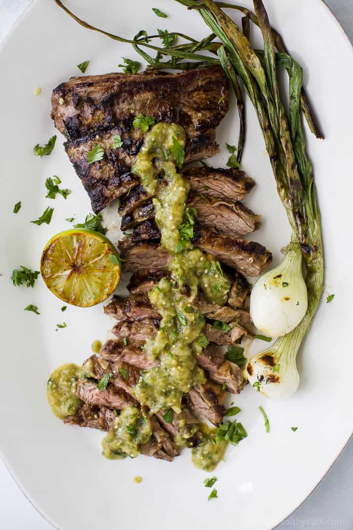 Tender grilled Carne Asada that's marinaded in a homemade Salsa Verde then charred to perfection for one authentic mexican dish! This flavorful low carb Carne Asada will be a hit at your house! Great for a weeknight dinner or dinner parties! #paleo #glutenfree