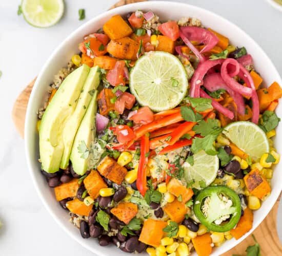overhead photo of easy sweet potato black bean quinoa bowls with crema in a bowl