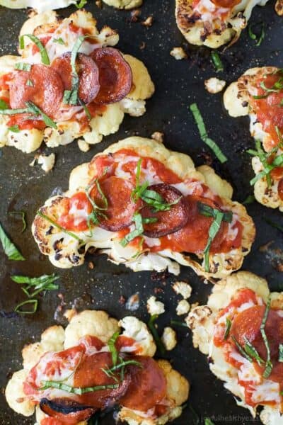 菜花steak pepperoni pizzas topped with fresh basil